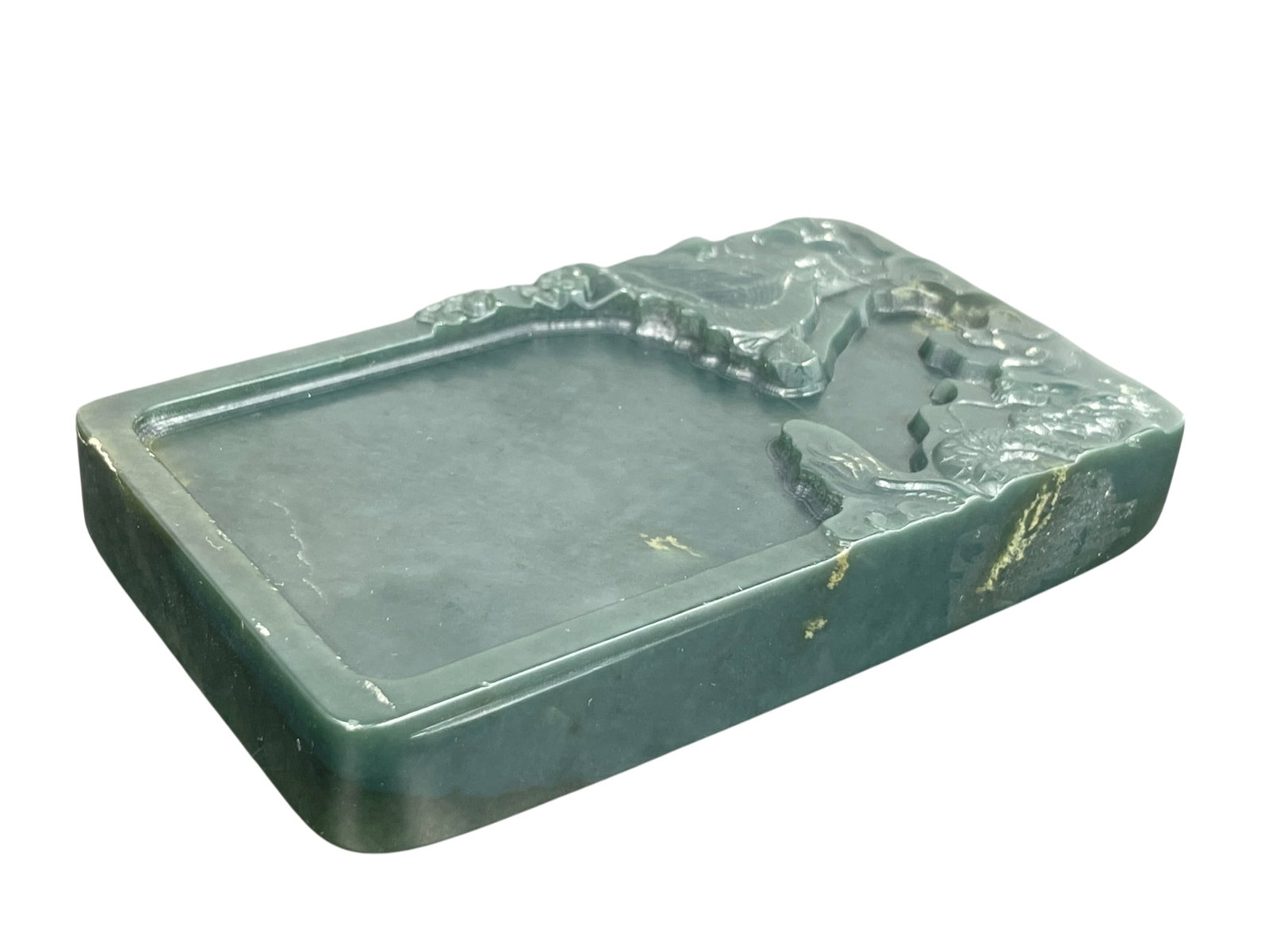 A Chinese Carved Spinach-Green Jade Inkwell: 3/4 in. high, 4.1/2 in. long, 2.3/4 in. wide.