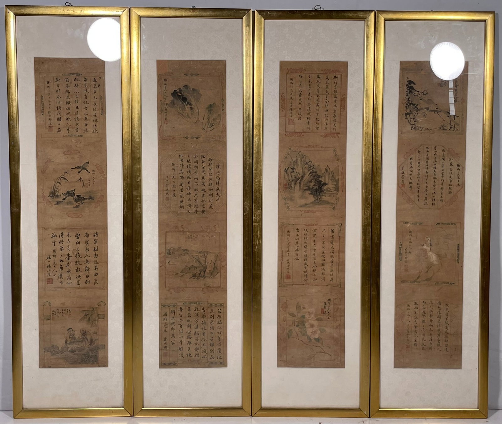 A Set of Four Chinese Wall Panels: Features calligraphy written by various artists, signed and with seals. 31.1/2 in. x 7 in. for the calligraphy each; 41.1/2 in. x 12 in. each overall including the frame.