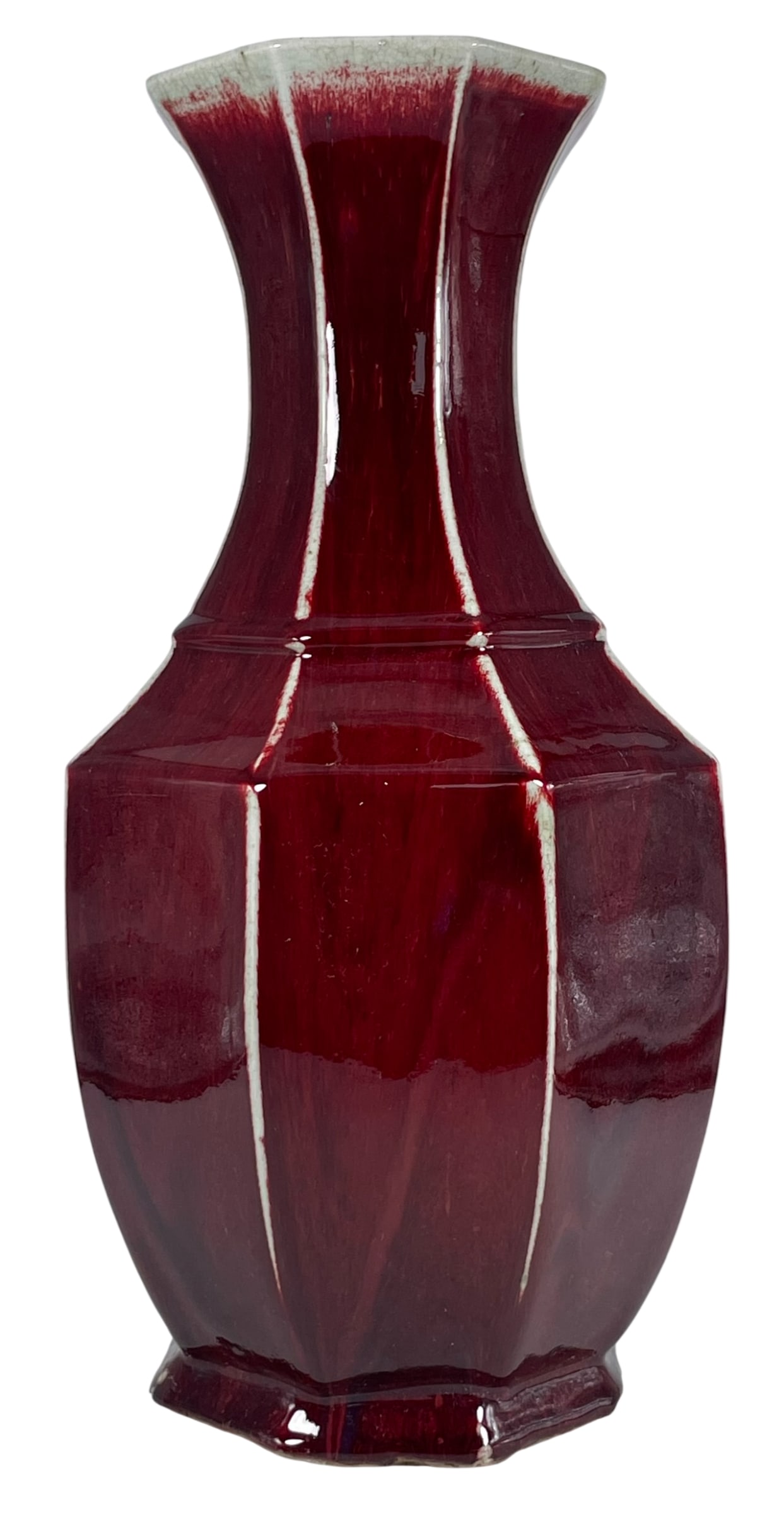 A Chinese Large Red-Glazed Octagonal Porcelain Vase, Qing Dynasty: 18.1/2 in. high, 9 in. wide.