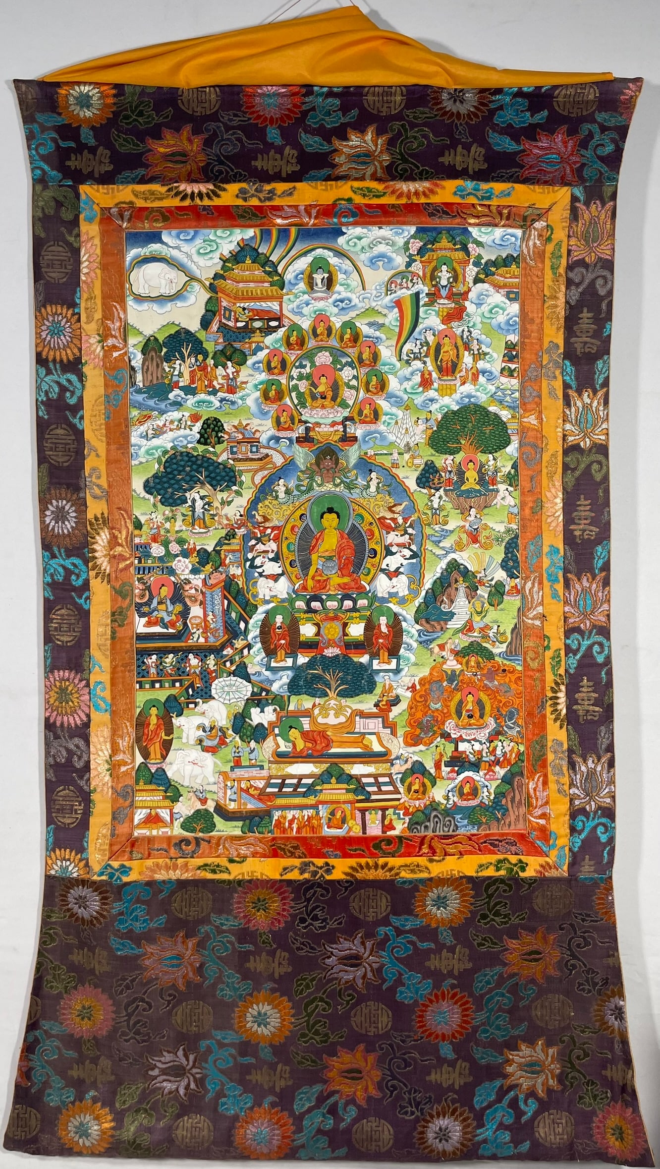 A Tibetan Painted Buddha Life Story Thangka: 30 in. x 20 in. for the painting; 53 in. x 33 in. overall.