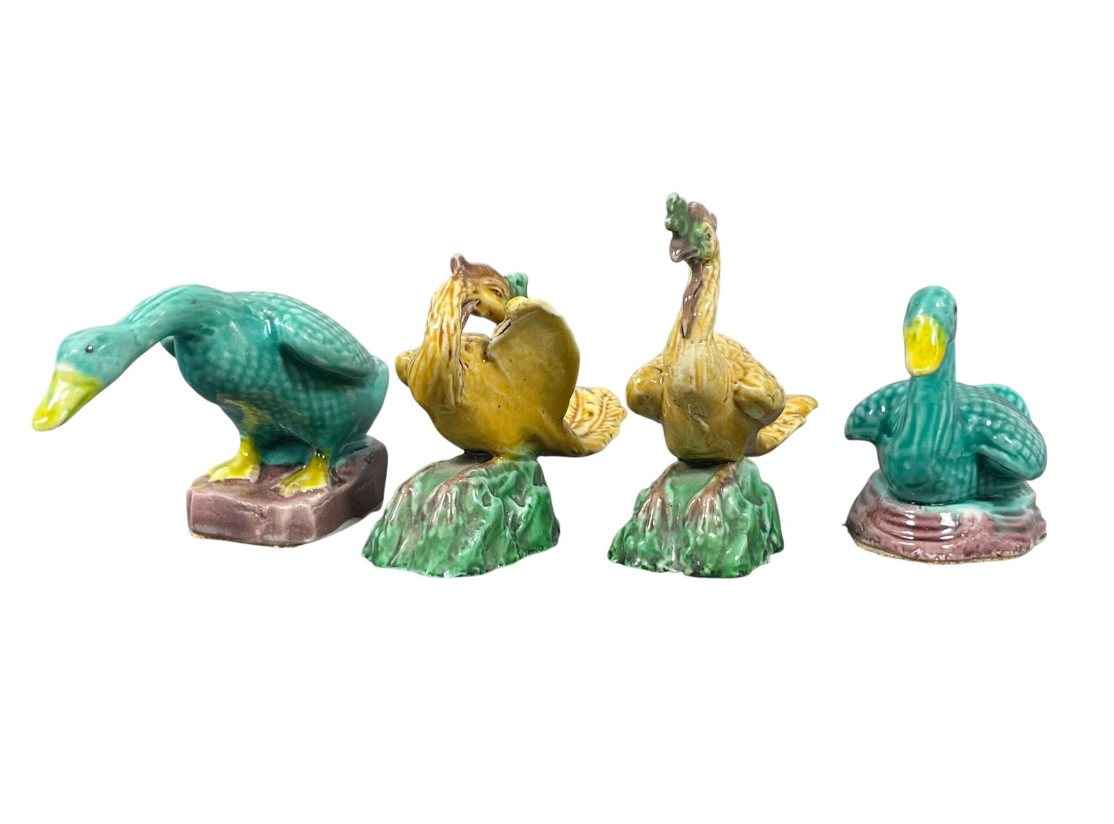 A Group of Four Chinese Turquoise and Yellow-Glazed Figures of Birds: The tallest measures 2.7/8 in. high, 3.1/4 in. wide.
