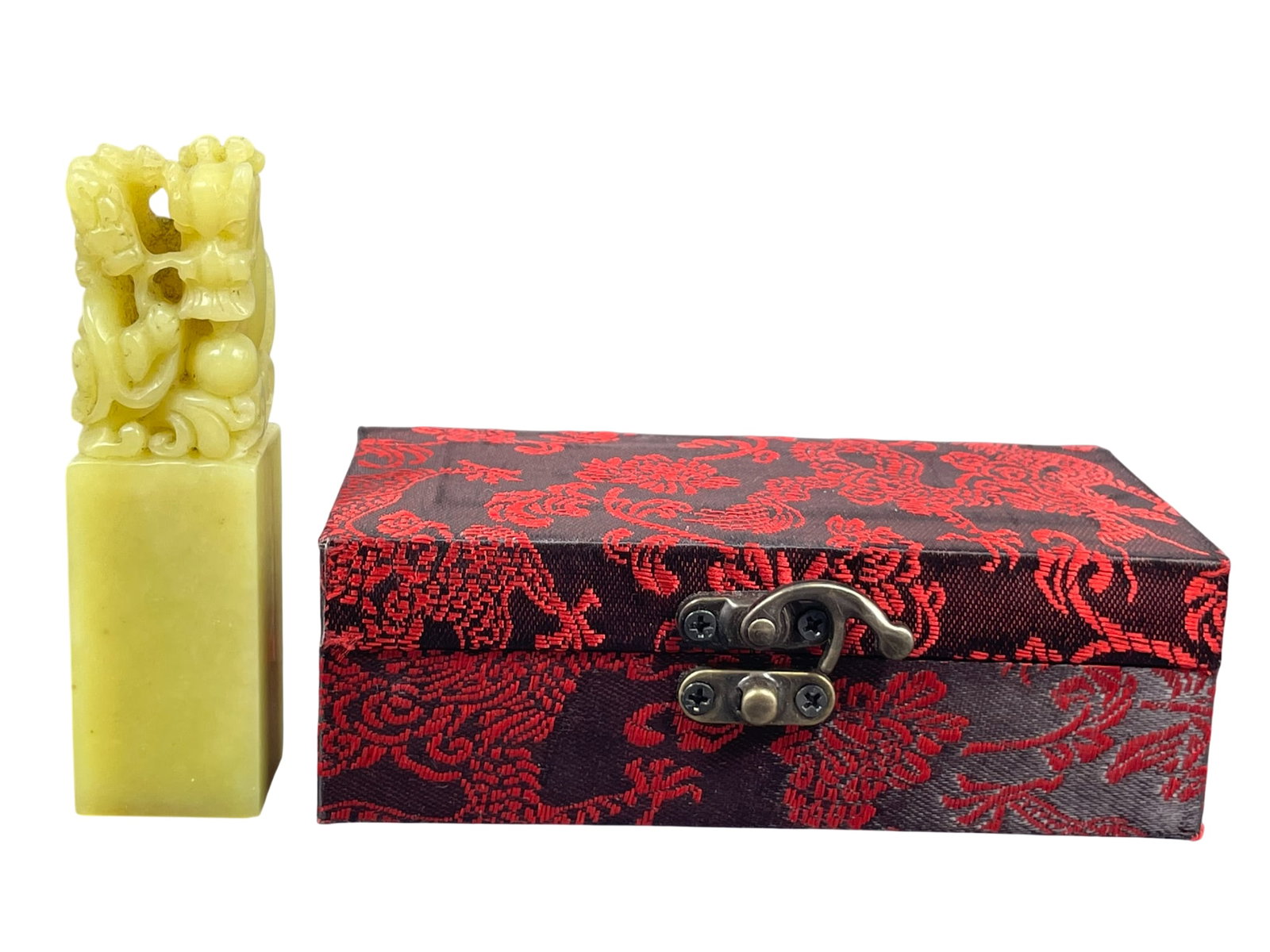 A Chinese Carved Soapstone Seal: With a cloth box. The seal measures 3.3/4 in. high, 1 in. square.