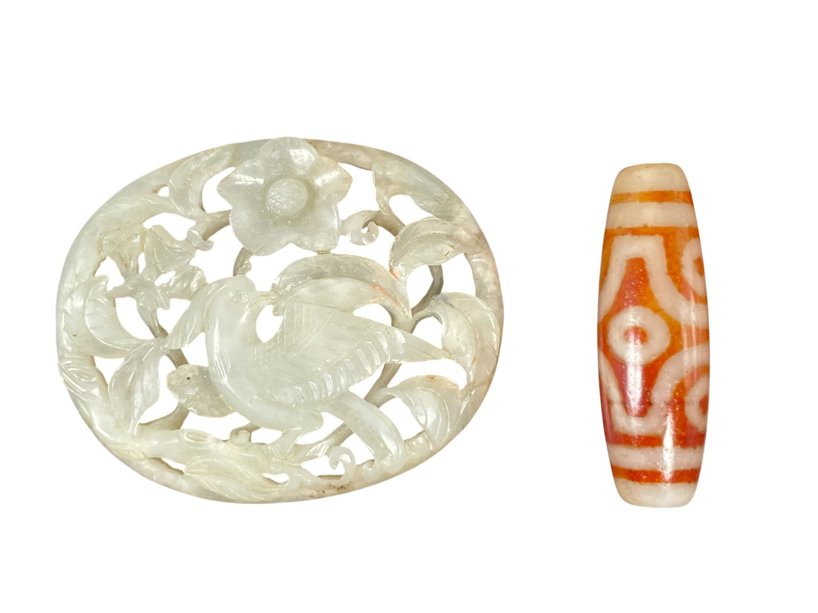 Two Chinese Decorative Accessories, Jade Plaque (Ming Dynasty) and Dzi Bead (20th Century): The plaque measures 2 in. long, 1.5/8 in. wide; the Dzi bead measures 1.1/2 in. long.