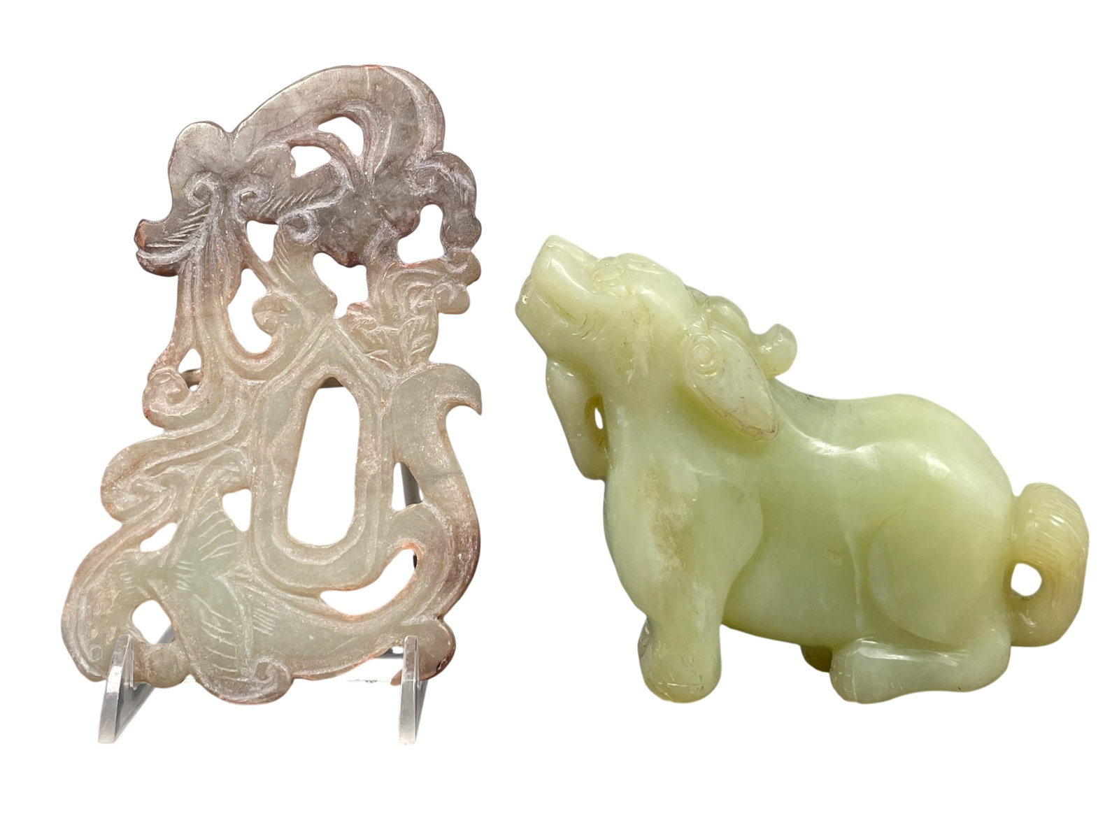 Two Chinese Jade Carvings: Comprising a carved jade figure of goat, 4.1/2 in. high, 5.1/2 in. wide; and a jade plaque featuring an openwork, 6.1/4 in. long, 3.3/4 in. wide.
