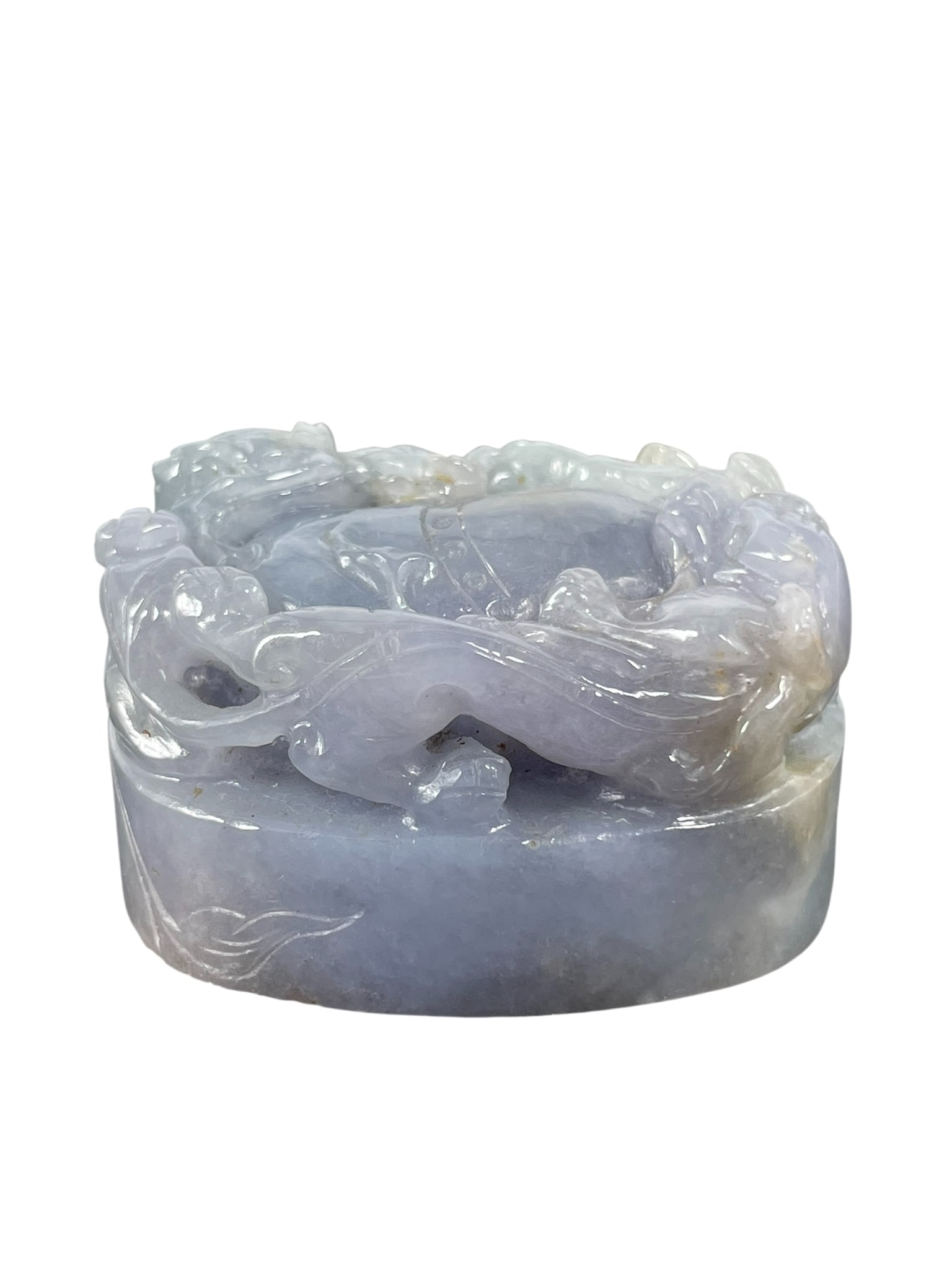 A Chinese Carved Mauve Jadeite Paper Weight: 1.1/4 in. high, 2 in. wide.