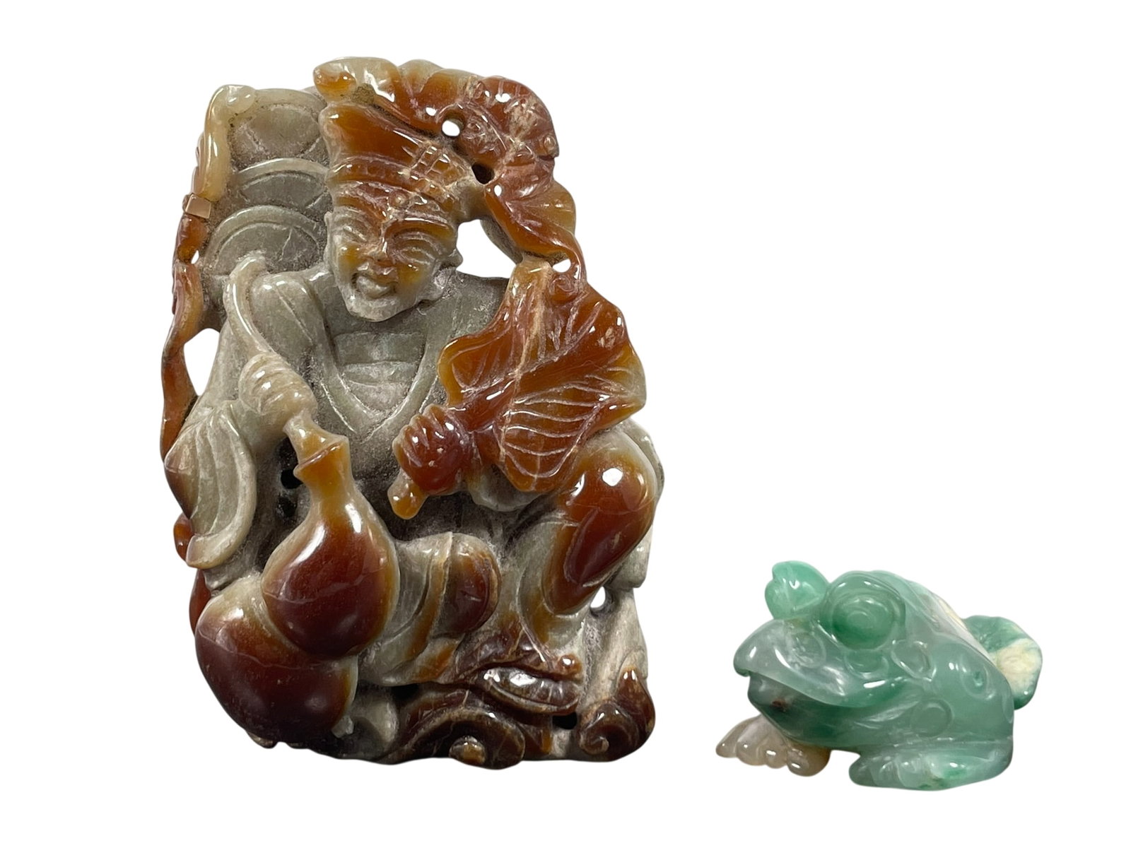Two Chinese Agate/Jadeite Carvings: The agate carving of immortal measures 3.7/8 in. high, 2.5/8 in. wide; the jadeite carving of a toad measures 1.1/8 in. high, 2.5/8 in. wide.