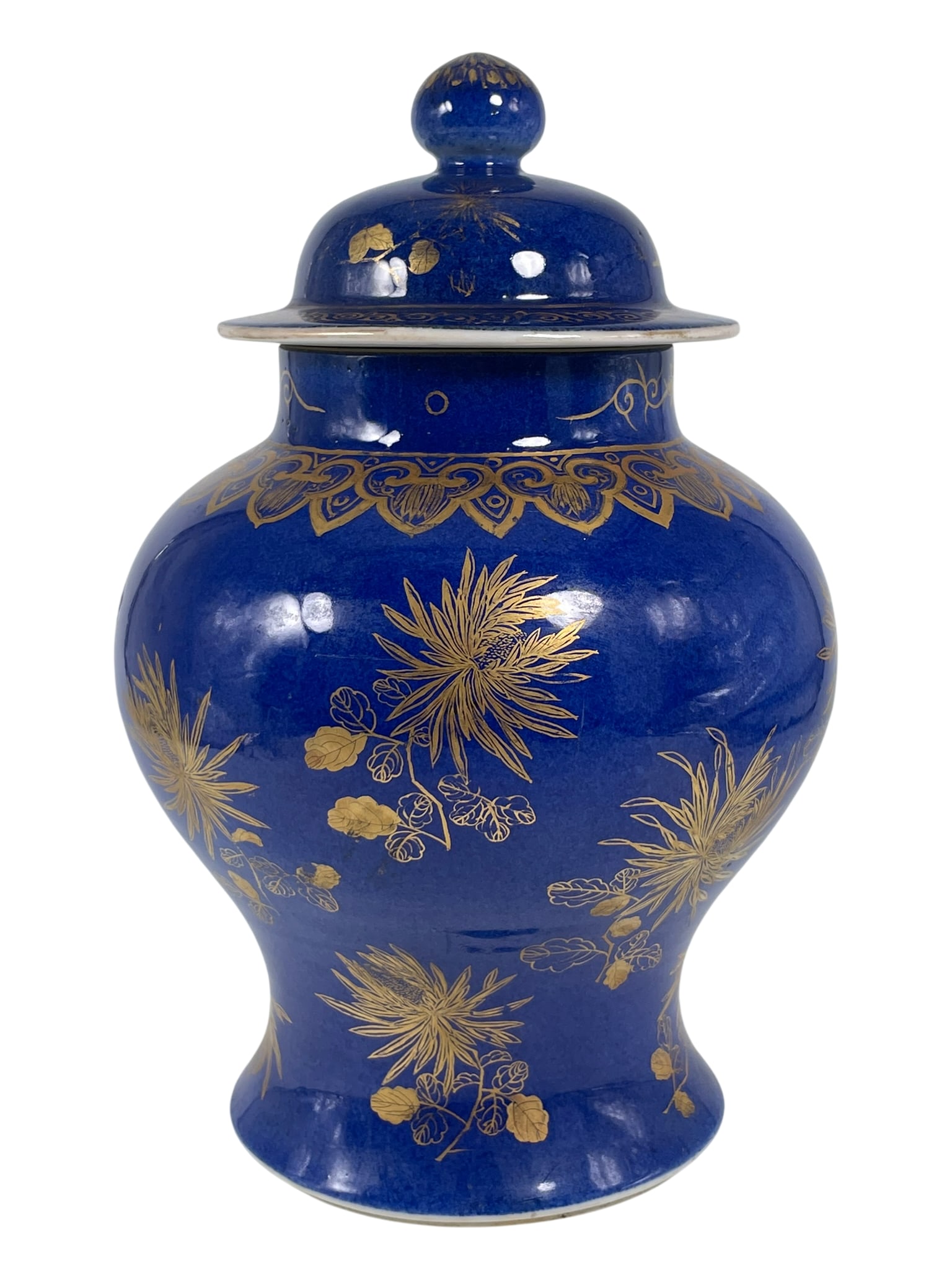 A Chinese Powder-Blue and Gilt-Decorated Jar and Cover: 11.1/2 in. high, 7.1/4 in. wide.