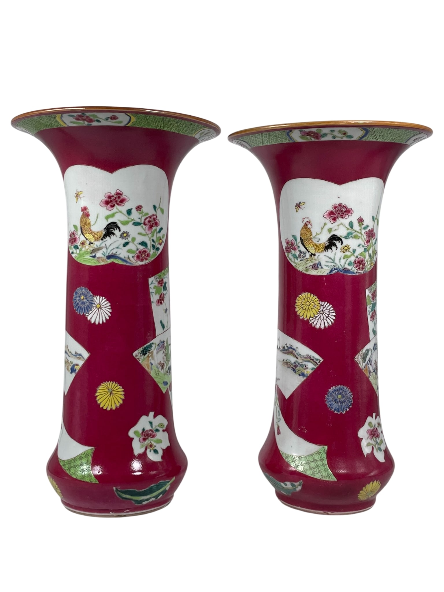 A Pair of Chinese Ruby-Ground Famille Rose 'Medallion' 'Roster' Porcelain Gu-Form Vase, Yongzheng: 13.3/4 in. high, 7.1/4 in. wide each.