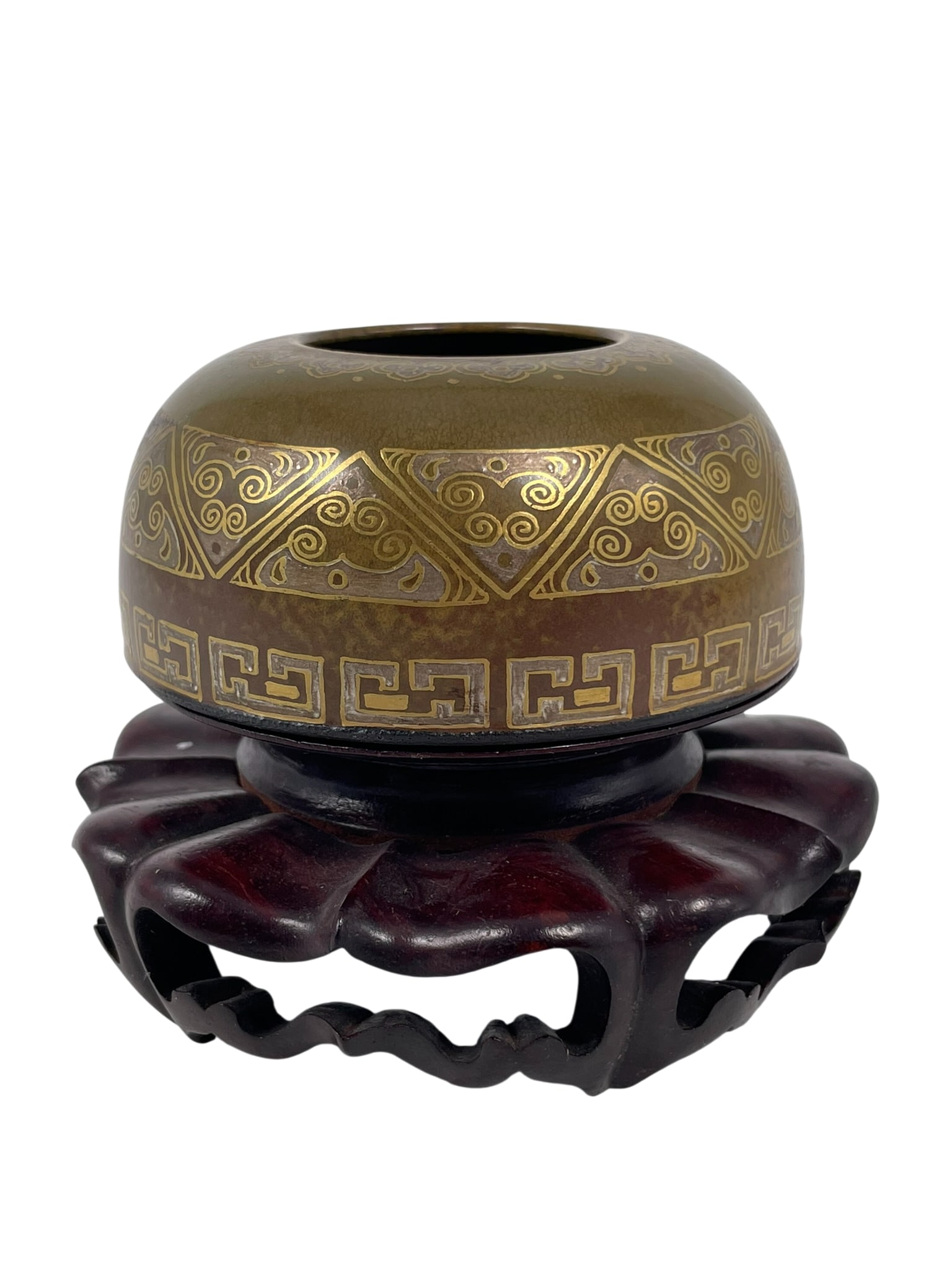 A Chinese Gilt-Decorated Tea-Dust-Glazed Porcelain Water Pot, Qianlong Mark and of the Period: With a wood stand. The water pot measures 1.1/2 in. high, 3.1/2 in. diam.