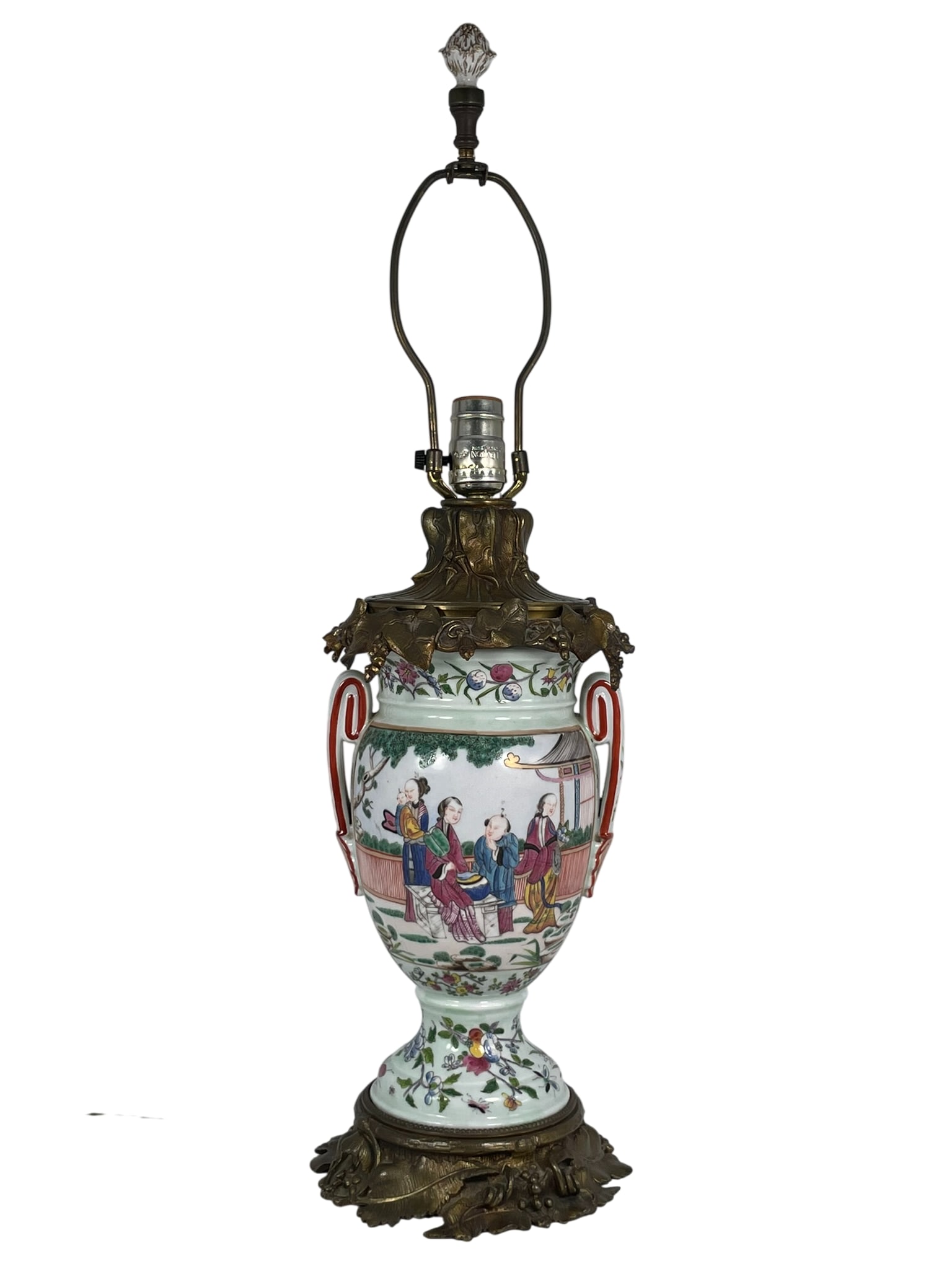 A Chinese Famille Rose 'Figural' Vase, Mounted as a Lamp: 11 in. high, 7 in. wide for the vase, 27 in. high, 7 in. wide overall.