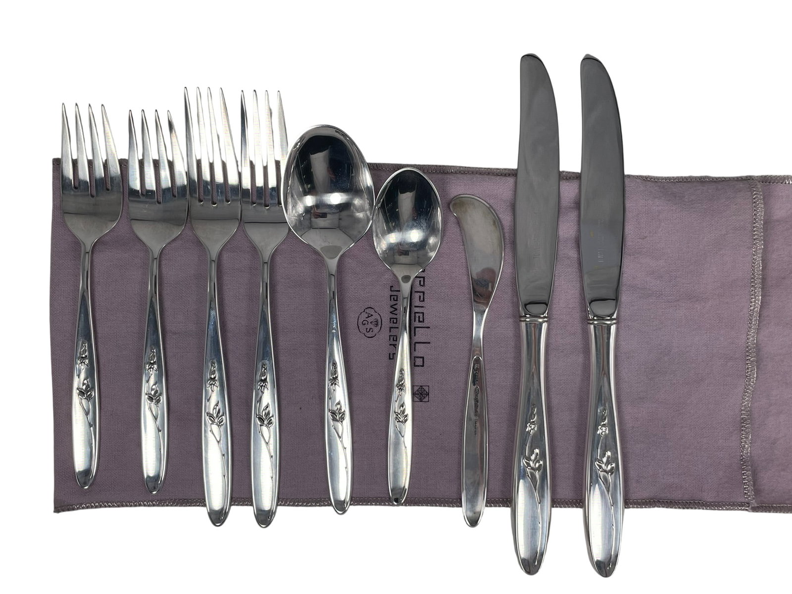 A Group of Nine Rose Solitaire by Towle Sterling Silver Flatware: Comprising a pair of forks, 7.3/8 in. long each, weighs 49 grams each; a pair of salad forks, 6.1/2 in. long each, weighs 35 grams each; a soup spoon, 6.5/8 in. long, weighs 39 grams; a teaspoon, 5.7/