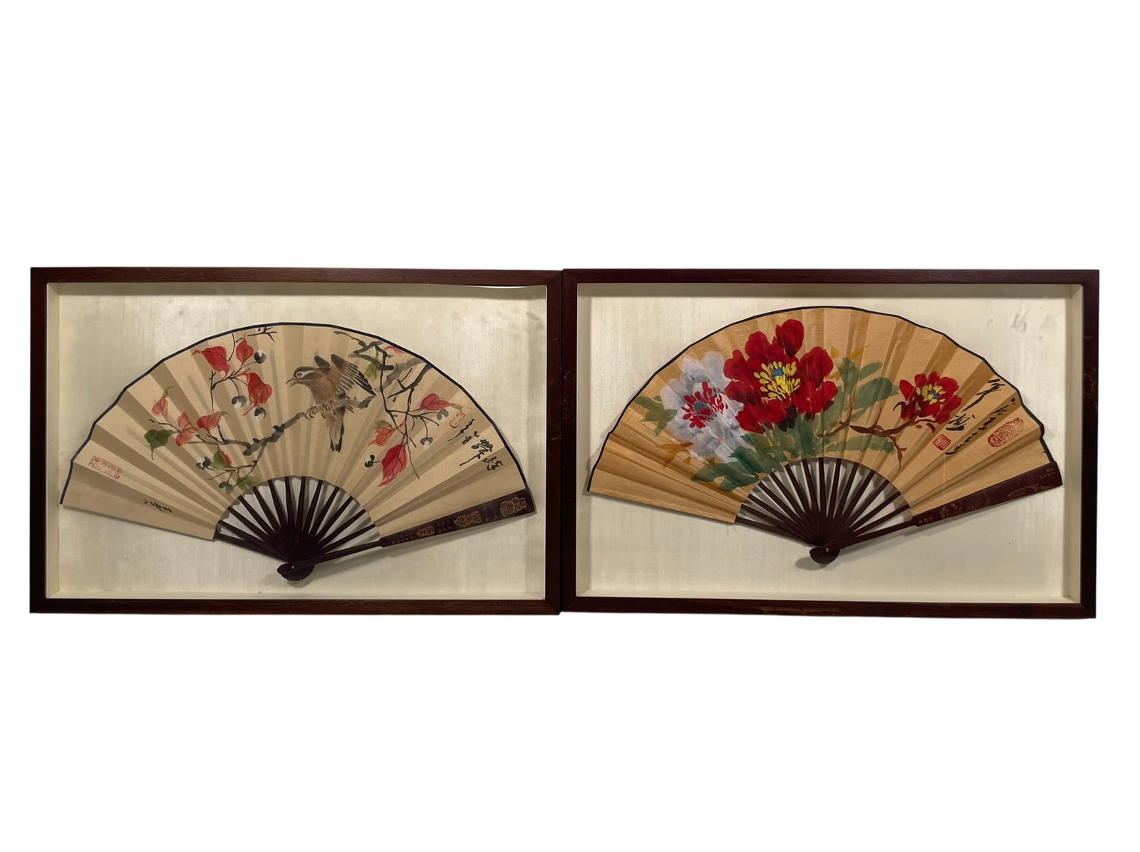 Two Chinese Painted Fan Leaves, Signatures Xiao Shi Wang: The smaller fan leaf measures 12.1/4 in. high, 23 in. wide; the larger fan leaf measures 13 in. high, 23.1/4 in. wide. 26 in. x 17 in. for the frames each.