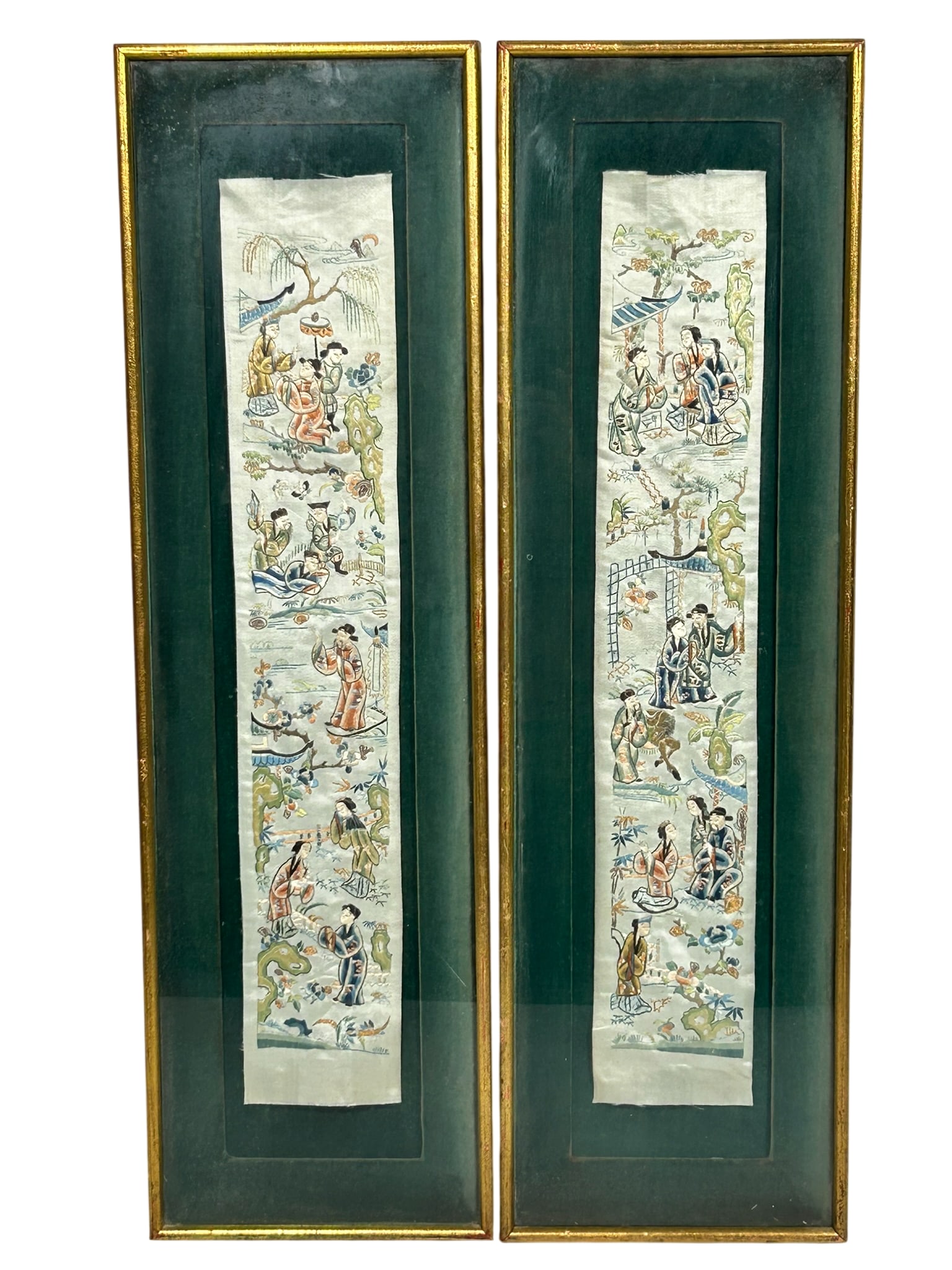 A Pair of Chinese Embroidered Silk Panels: 29 in. x 8.3/4 in. overall including the frame each.