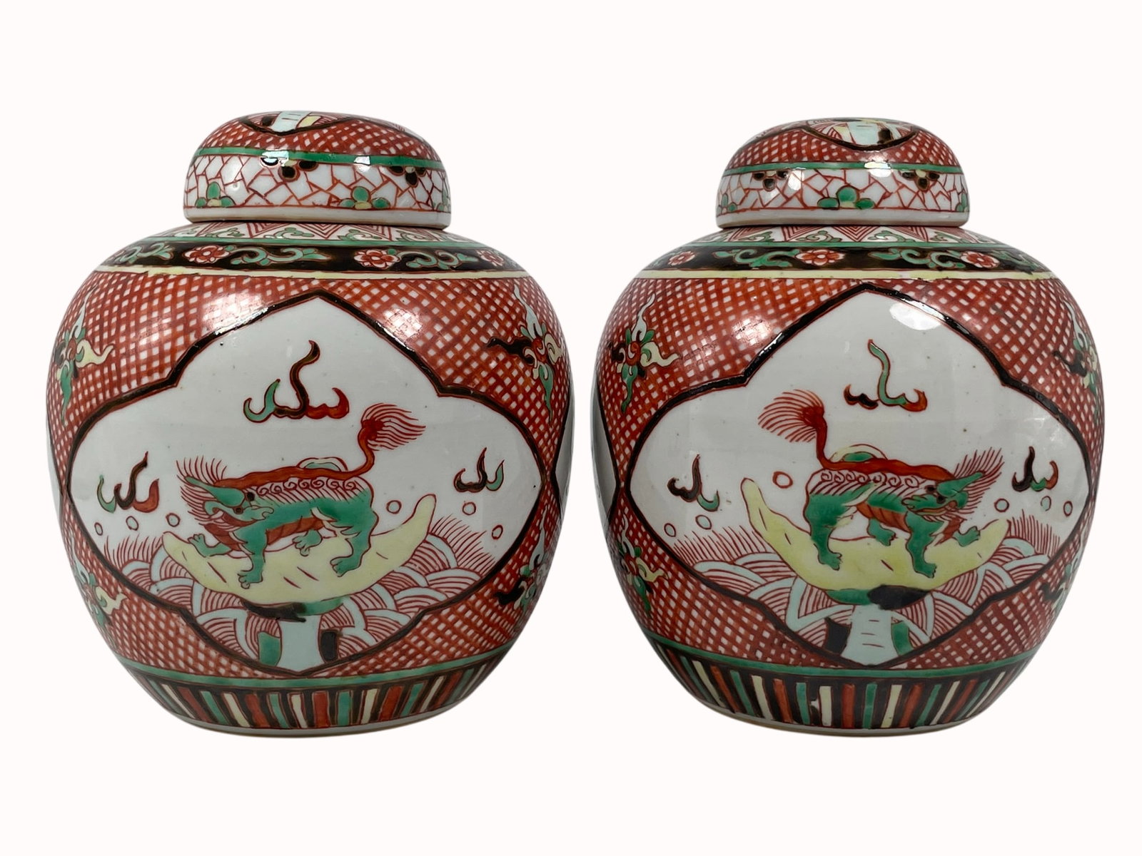 A Pair of Chinese Famille Verte 'Mythical Animal' Jars and Covers: 7.1/2 in. high, 6.1/2 in. wide each.