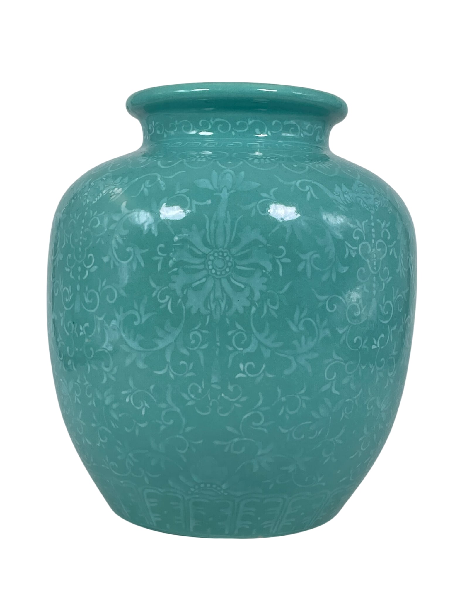 A Chinese Green-Glazed Jar: 9.1/4 in. high, 7.1/2 in. wide.