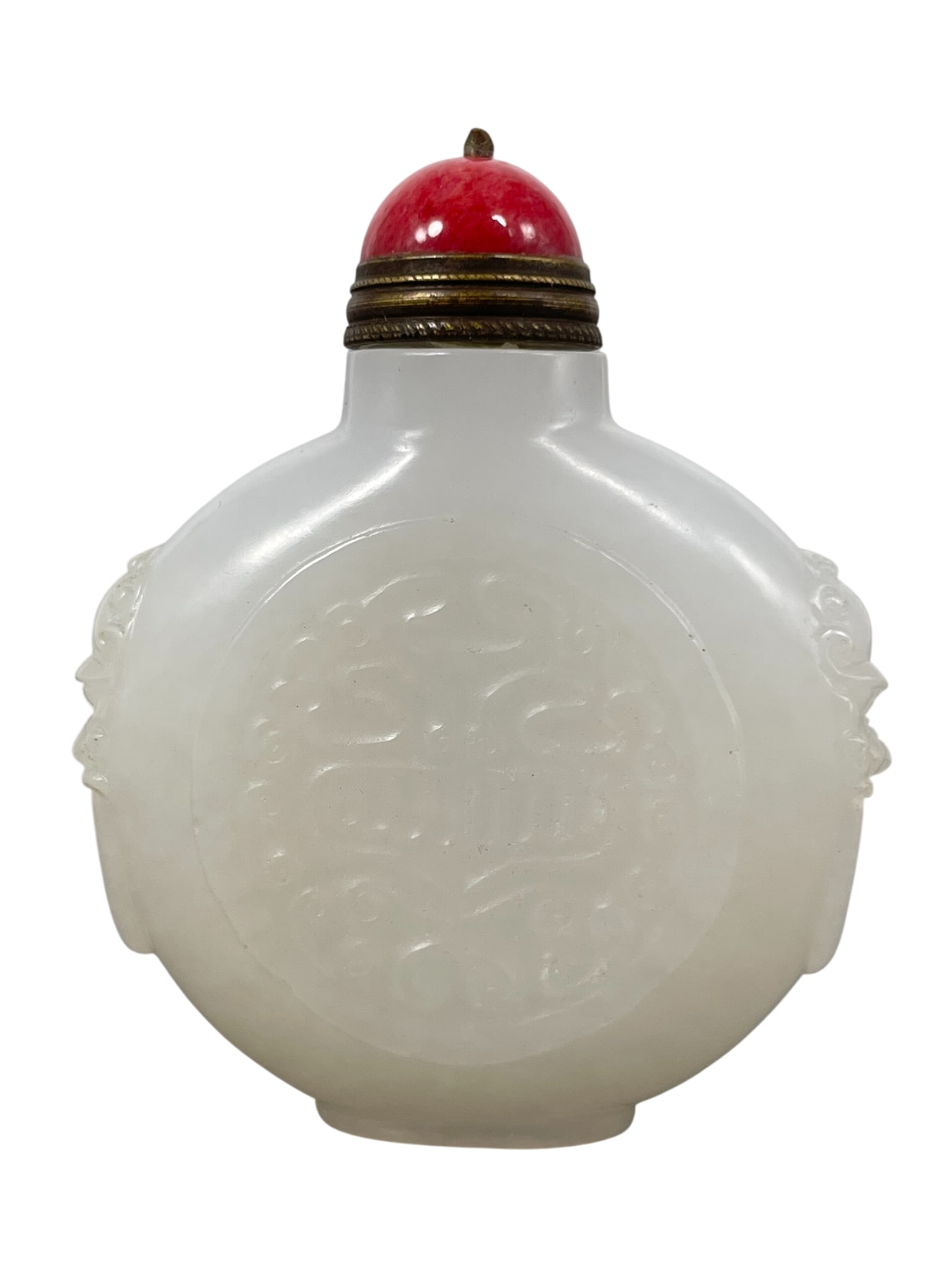 A Chinese Carved White Jade Snuff Bottle: 2.1/2 in. high, 2.1/8 in. wide.