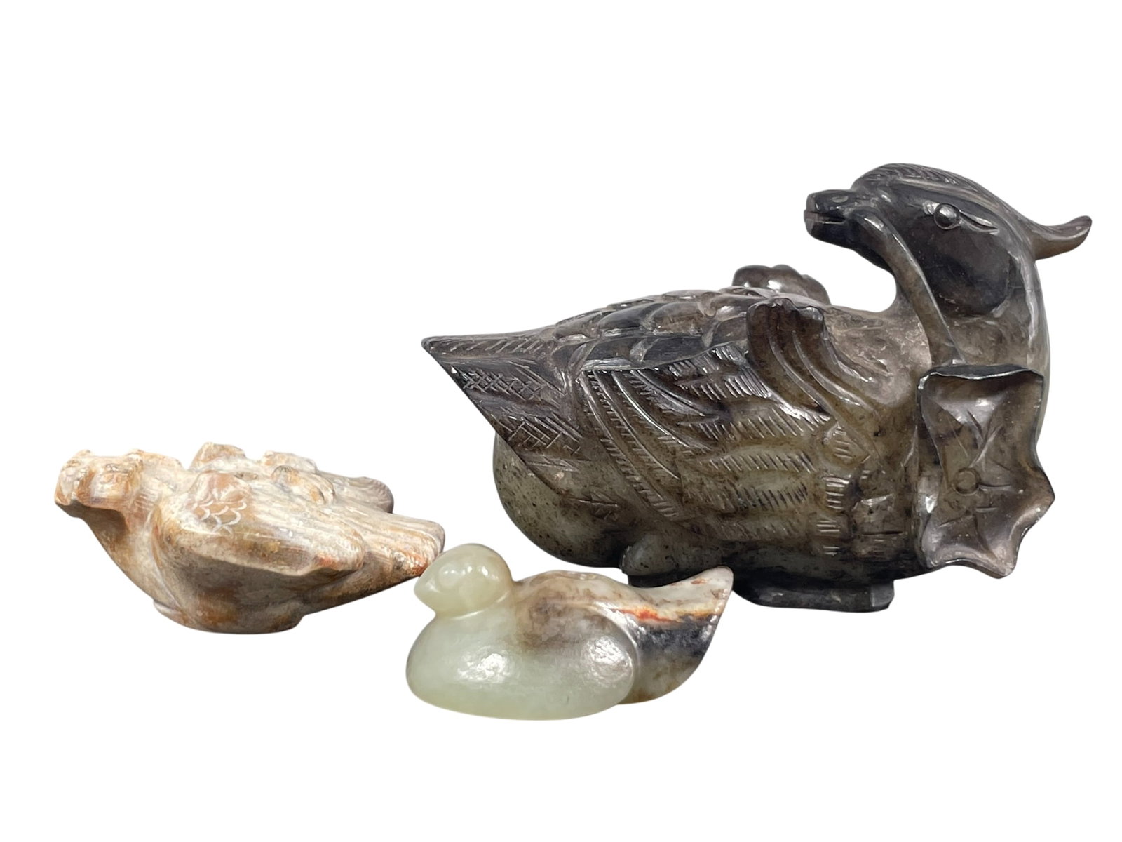 A Group of Three Chinese Jade Carving of Birds: The largest measures 2.1/2 in. high, 4 in. wide.
