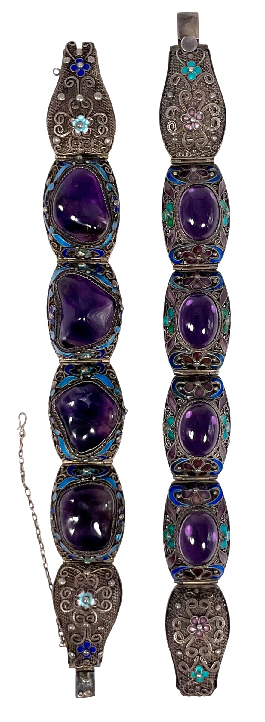 Two Chinese Amethyst Stone-Inset Silver Filigree and Enamel Bracelets: One with a mark 'silver' on the clap, 7 in. long, 7/8 in. wide overall; the other measures 8 in. long, 3/4 in. wide overall.