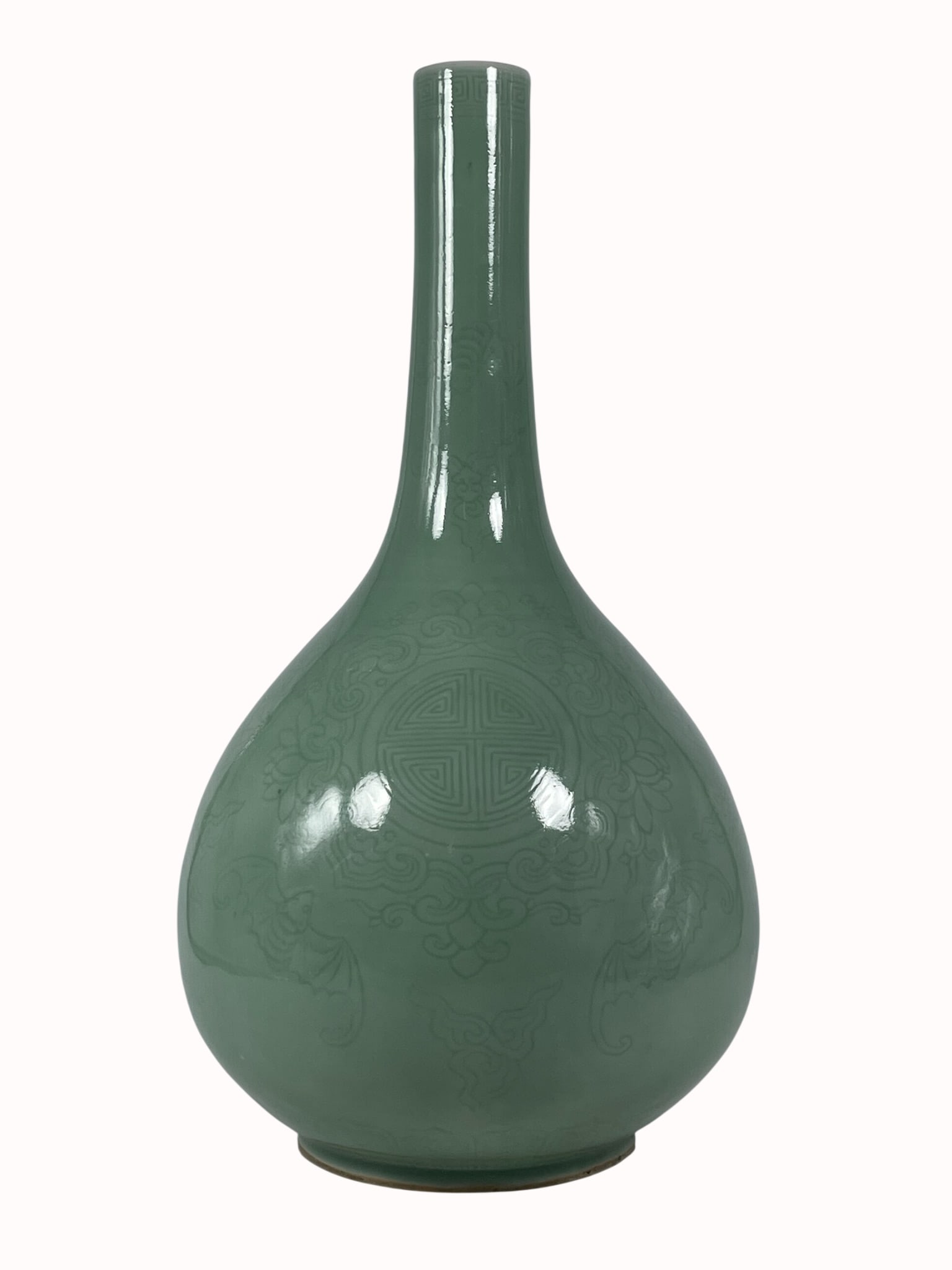 A Chinese Incised Celadon-Glazed Bottle Vase, Kangxi Mark: With a wood stand. The vase measures 16.1/2 in. high, 8.1/2 in. wide.