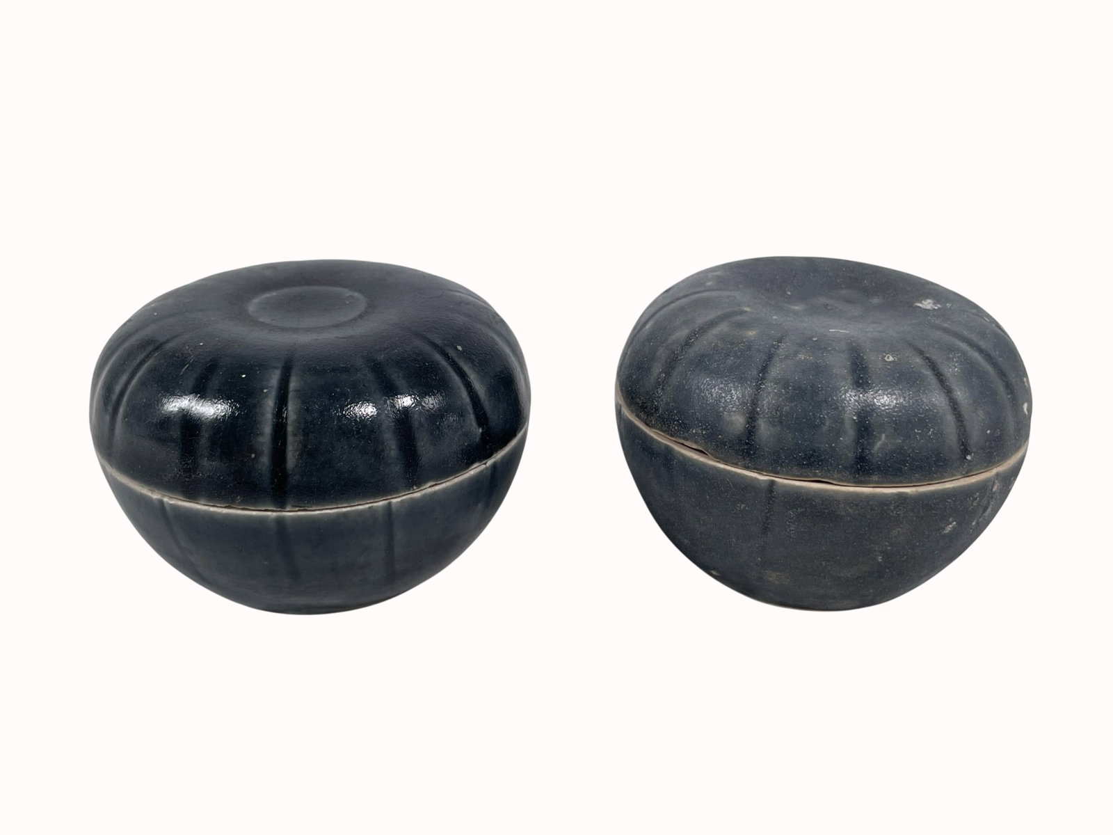 Two Vietnamese Green-Glazed Boxes and Covers: 2 in. high, 2.5/8 in. diam. each. A Private Collection of a Retiring University Professor.