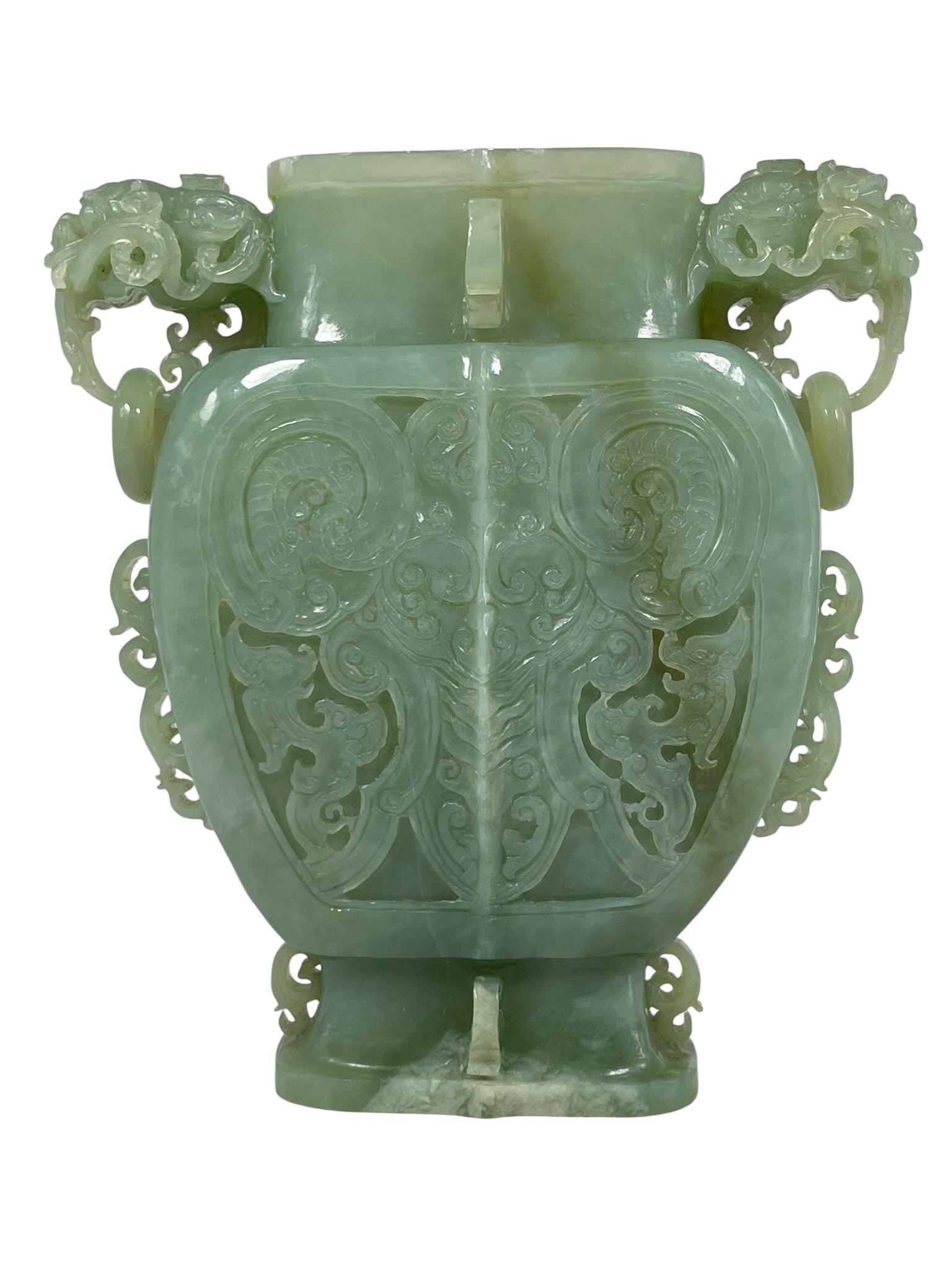 A Chinese Carved Jade Vase: Without cover. The vase measures 8.5/8 in. high, 8 in. wide.