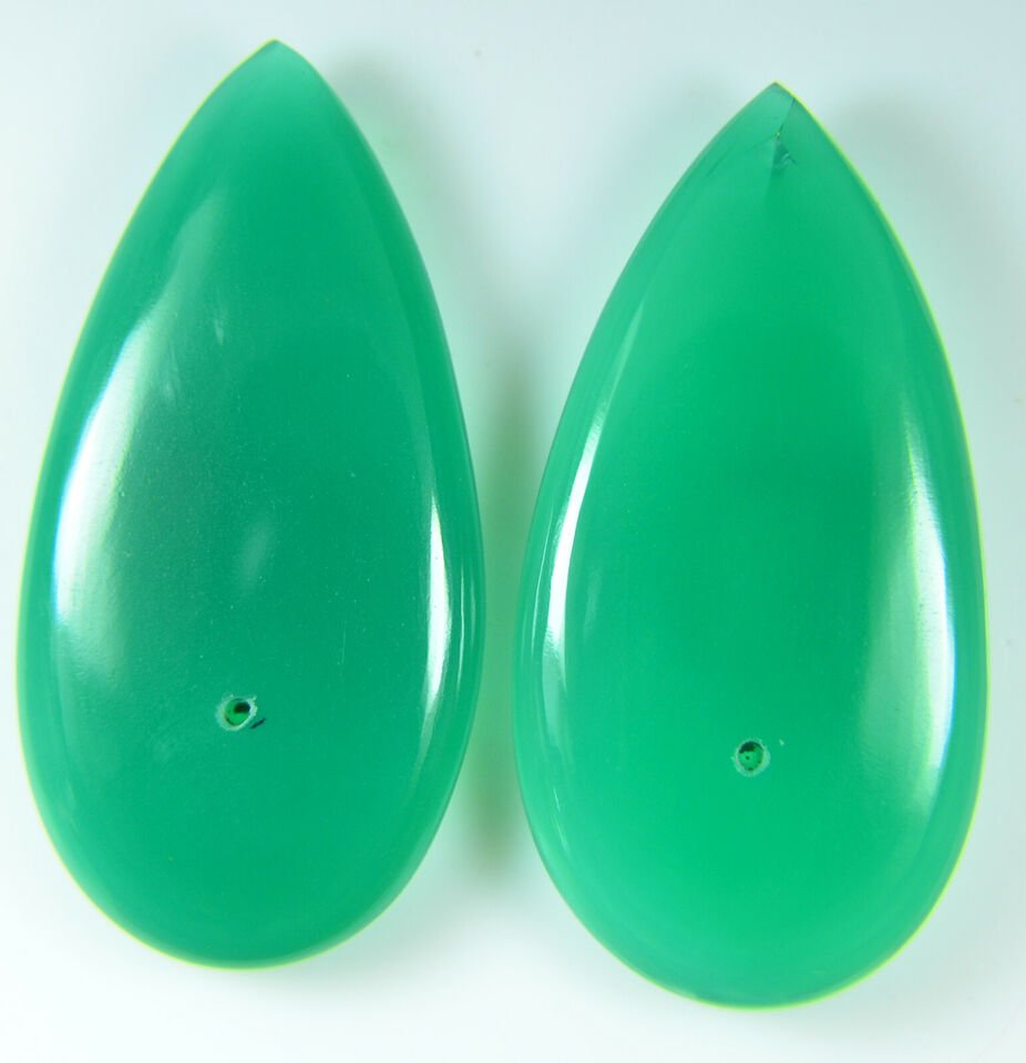 64.50Cts Natural Green Onyx Chalcedony Plan Smooth Mached Pair Cabochon Gemstone: Item Name:- Chalcedony // Item weight in carat:- 64.50// item Dimension(Size)in milimeter:- 44 mm,22 mm, 5 mmitem // item creation :- Natural // litem country of origin :- africa// ITEM Treatment :- N