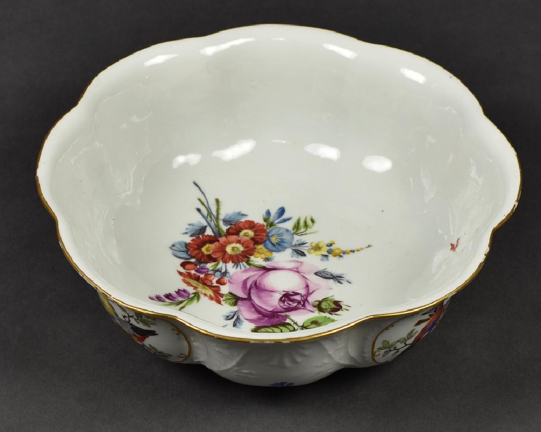 Birds and Flowers Bowl, Cross Swords Mark: White bowl having a scalloped, gilt edge, flowers on the base, the exterior having panels of different birds between a raised decoration of flowers, 3"H x 9"W.