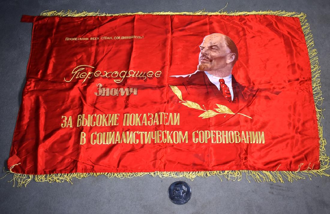 Red Satin Soviet Banner & Metal Medallion: Banner having painted image of Vladimir Lenin on one side, a globe on the other, yellow fringe on three sides, 69"H x 42"W. Along with a white metal medallion with Lenin bust in relief, Cyrillic lette