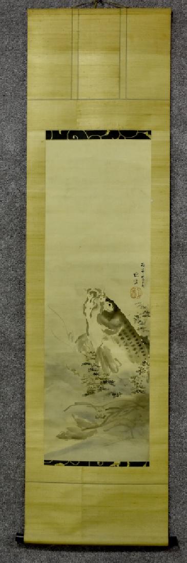 Antique Chinese Scroll: Hand-painted ink on silk; brocade silk mounting. Image of a large fish leaping from water. Signed and with red seal. 68" H x 18 1/4" W. Wooden roller ends. Good condition.