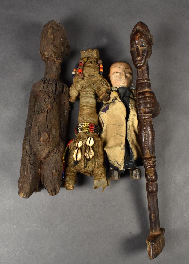 4 Miscellaneous African Figures: Includes doll made of bone with beading and shell detail and a small wooden doll with fabric clothing. Largest 14" H x 2 1/2" W.