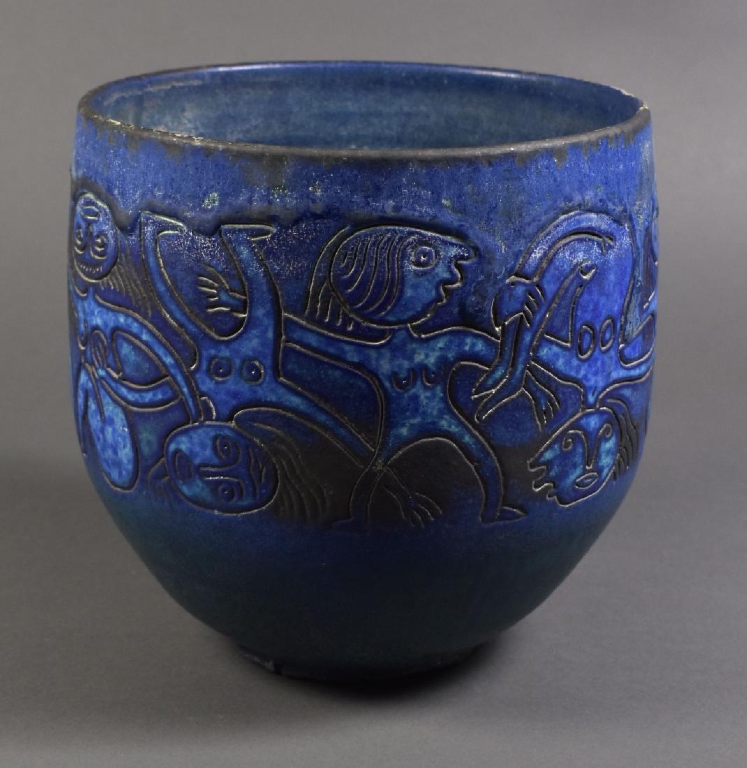 Scheier Pottery Vessel by Edwin & Mary Scheier: Dark blue glaze with stylized figures. 8 1/2" H x 8 1/2" diameter. Some residue from being used as a planter. Otherwise good condition.