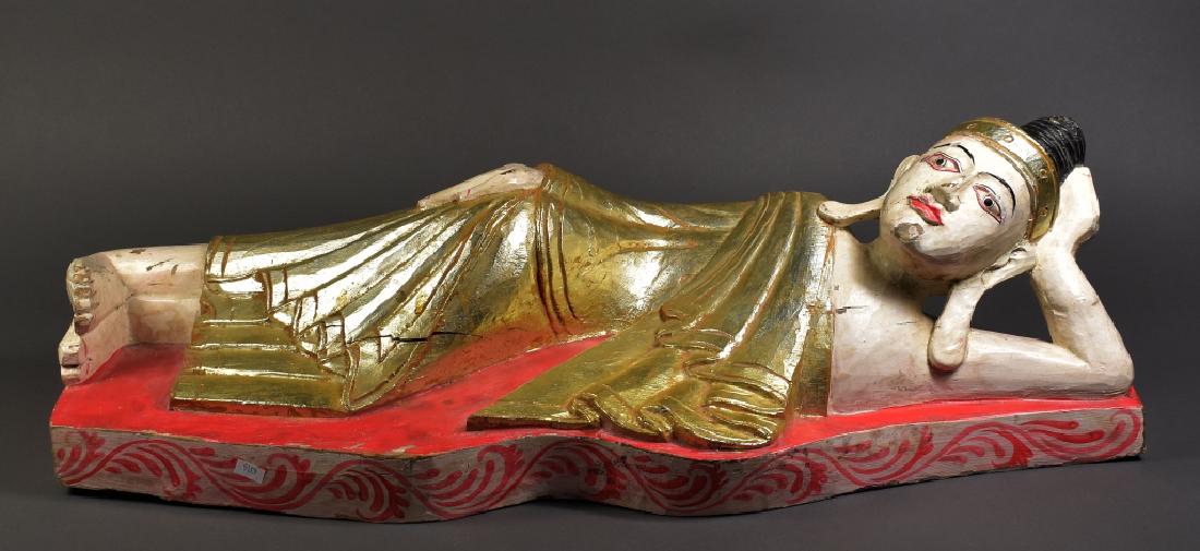Carved Wood Reclining Thai Buddha: Red, white, and gilt. 31" H x 10" W x 9 3/4" D. Good condition.