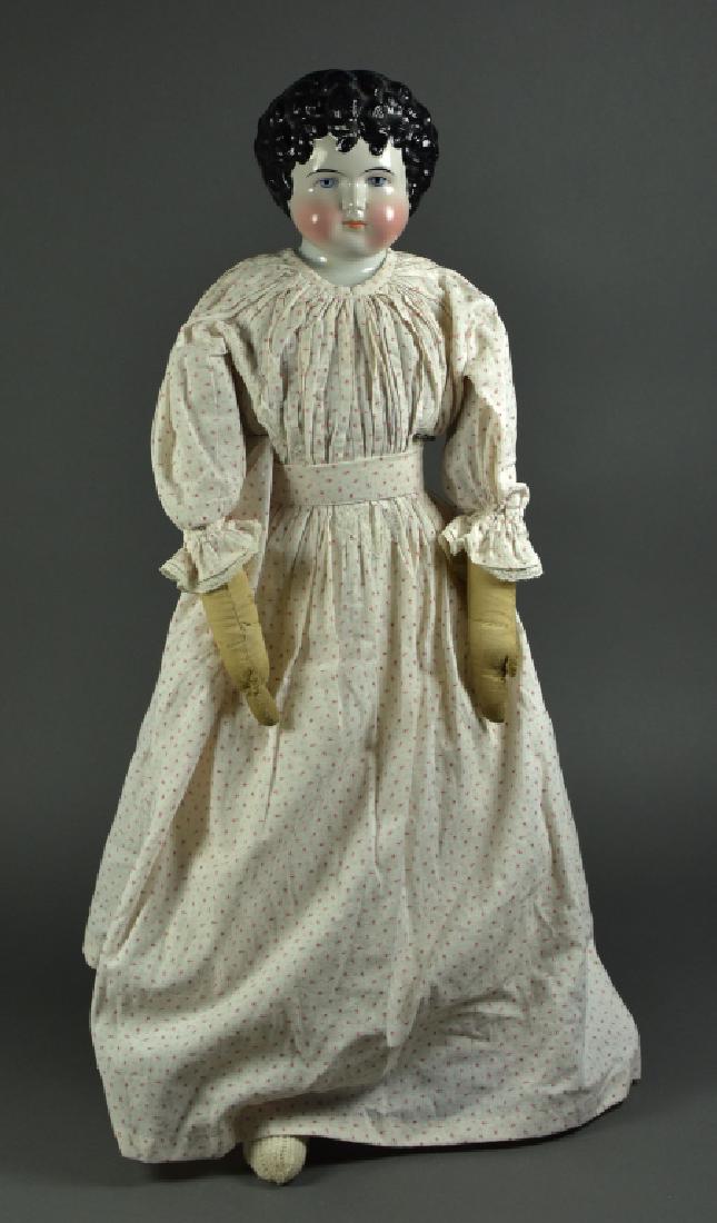 German China Shoulderhead: 27". By Alt, Beck and Gottschalck. Blue painted eyes, black hair falling over forehead, antique cloth body, arms. Nice antique clothing.