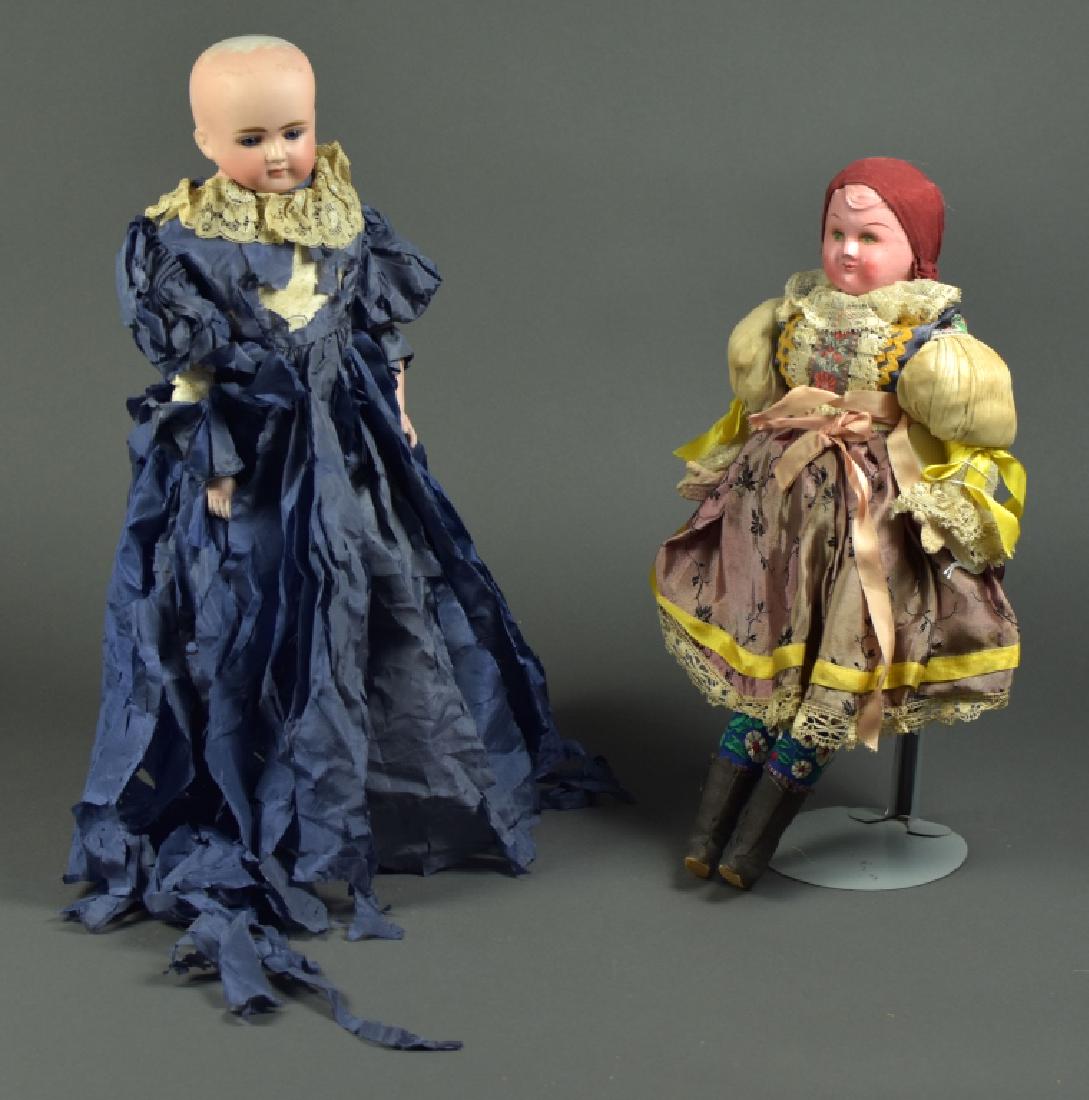 German Alt, Beck and Gottschalk Shoulderhead Doll: 19". Blue set paperweight eyes, dome head bisque lower arms, closed mouth. Shoulderplate has heavy damage. Kid leather body with hip rivet joints, heavy patching. Also 16" German celluloid shoulderhea