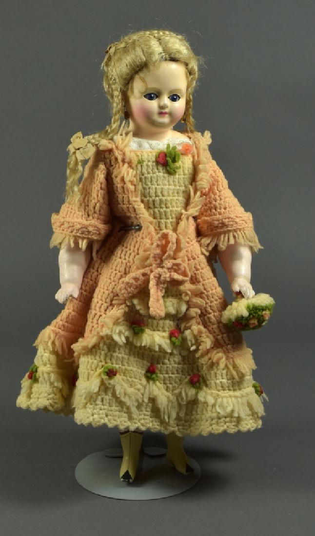 Wax Over Composition Shoulderhead Doll: 16". Blue sleep cobalt eyes, mohair wig, pierced ears. Lower composition arms and legs with cloth body. Painted boots on lower legs. Dressed in peach knit gown.