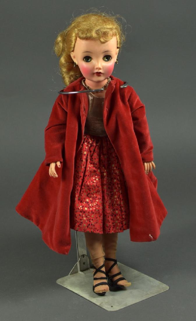 18" Ideal Revlon Doll: With vinyl head, rooted hair, hard plastic body with jointed waist. All original clothing. Still retains bright coloring, blue sleep eyes, and earrings.