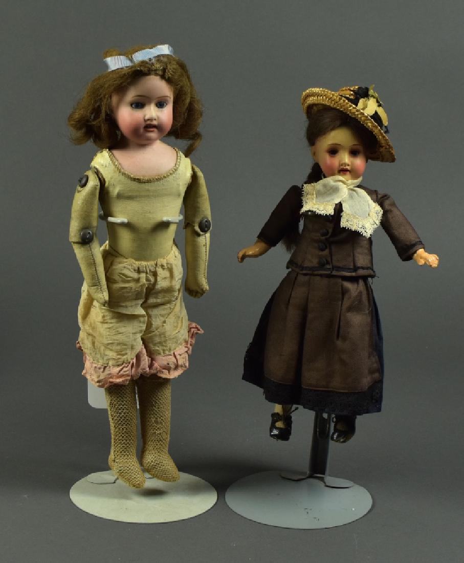 Japanese Shoulderhead Doll: 14"H. Blue set eyes, open mouth, human hair wig. Kid leather pin jointed body. Also, a 10" Armand Marseille 390 painted bisque. Brown sleep eyes, mohair wig. Papier mache body and possibly original cl