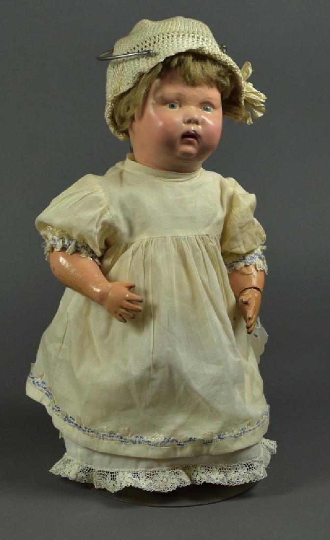 American Schoenhut Character Baby: 15". Marked head and body with sticker. 1911. Paint has been redone on face. Original eye paint. Some light chipping, original mohair wig. Nice antique clothing.