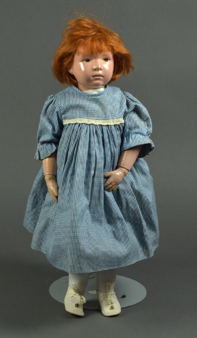 American Schoenhut Girl Doll: 16". Impressed Schoenhut on back. Brown painted eyes, original mohair wig. Paint touch ups at joints amd fingers. Redressed in vintage clothes.