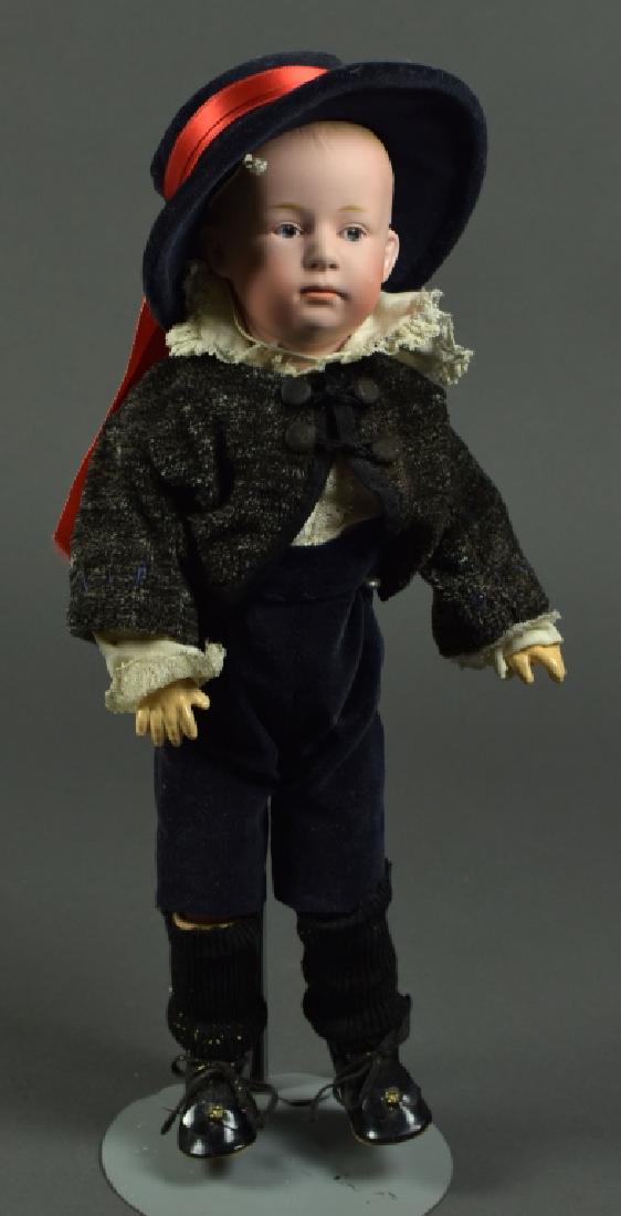 German Gebruder Heubach #6894: 13". Painted intaglio eyes, closed mouth, molded painted blonde hair. Composition and wood ball jointed body.