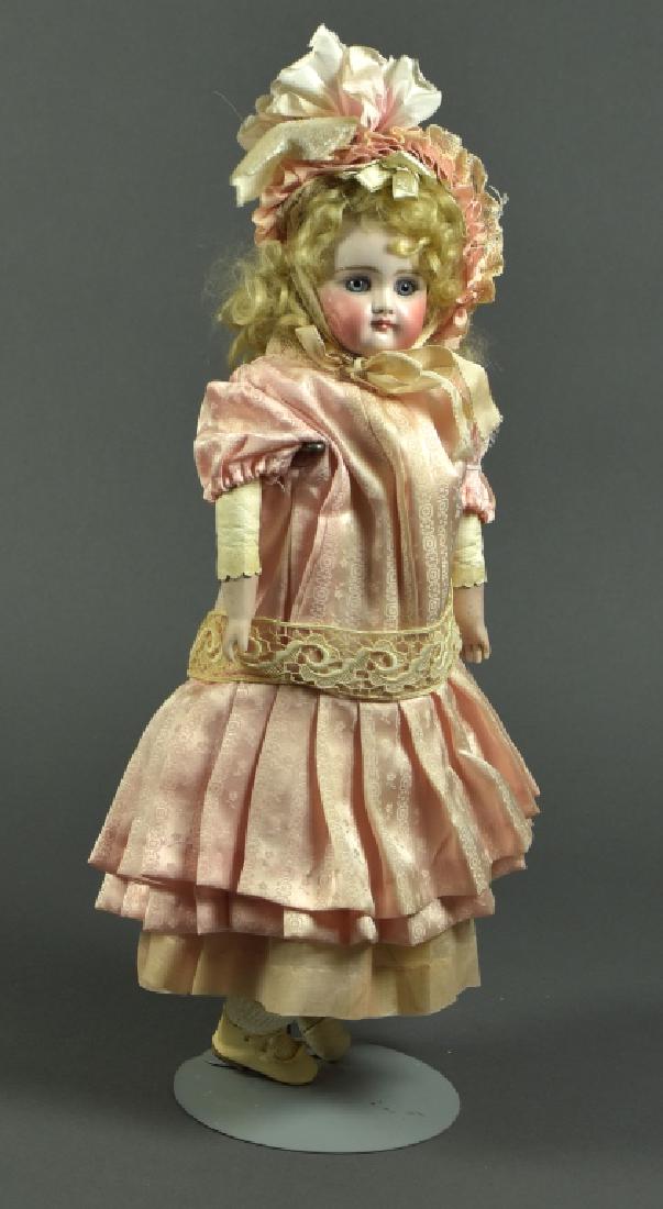 German Kestner Shoulderhead Doll: 16". Blue set paperweight eyes, closed mouth, mohair wig. Kid leather body. Bisque hands. Original plaster pate. Very nice vintage clothing. Missing a sock and shoe.