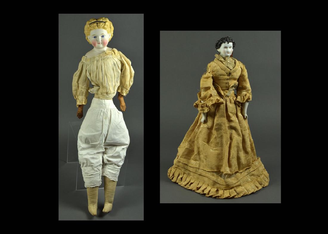 German Parian Shoulderhead Doll: 28". Blonde painted hair, blue painted eyes, molded blue cobalt ribbon in hair, pierced ears. Antique cloth body, leather arms. Dressed in underclothes. Also 17" German parian "Countess Dagmar", brown