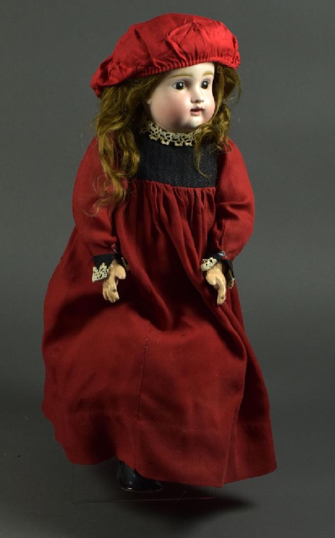 Early German Kestner Doll: 20". Marked with 12. Hairline across top of front forehead. Brown set eyes, repainted rough body- open mouth with teeth. Dressed in vintage and antique clothes. Brown mohair wig.