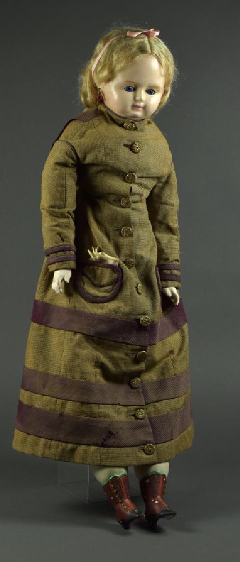 Wax Over Composition Shoulderhead Doll: 26". Blue cobalt sleep eyes, mohair wig, pierced ears, newer cloth body with composition lower arms and legs, painted boots. Dressed in antique linen coat with brass buttons on front.