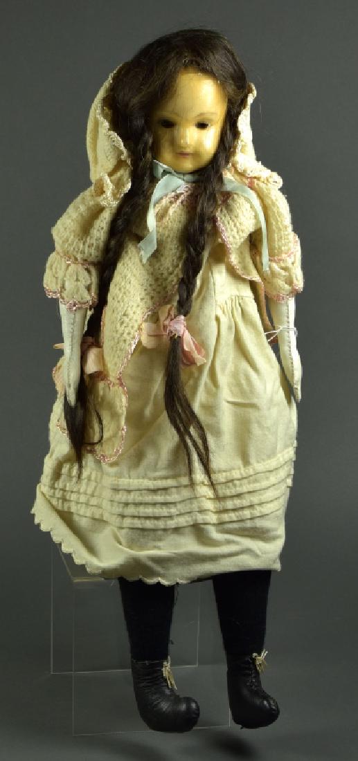 English Wax Shoulderhead Doll: 25". Brown inset glass eyes, closed pouty mouth, human hair wig. Cloth vintage body with sewn on shoes, lower leather arms. Nice antique clothing.