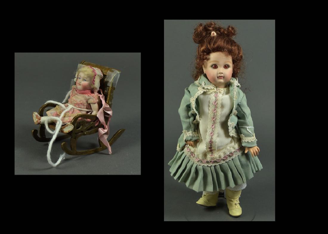 German All Bisque Stationary Head Doll: Blue painted eyes, open-close mouth, mohair wig, brown shoes, antique clothing. Sitting is solid brass ornate rocker. 5" H. Along with a 15" reproduction French A.T. on composition body. Well dressed 
