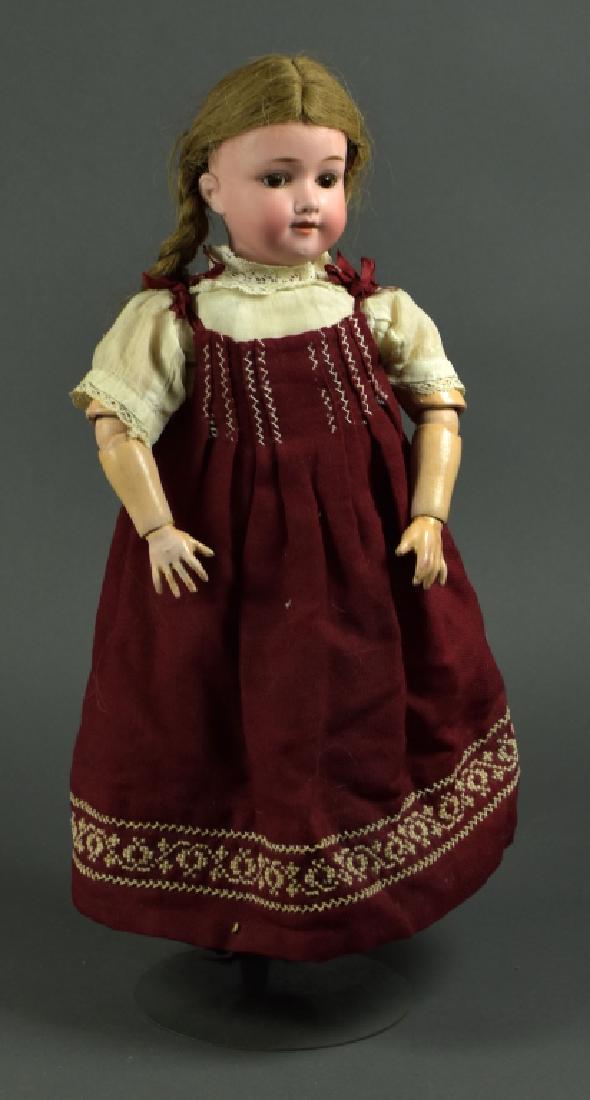 German Armand Marseille 390 Girl: 18". Brown eyes on rocker ( loose and have to be reset ). Open mouth teeth. Brown human hair wig. Wood and composition body needs restringing. Eyes packed in head but loose.