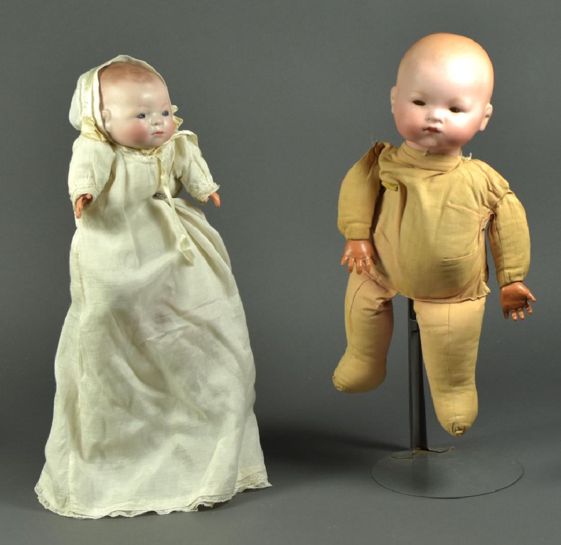 German Grace Putnam Bye-Lo Baby: 12". Blue sleep eyes ( eye chip ). Painted features on dome head with flange neck. Stamped Grace Putnam body. Celluloid hands. Antique dress and bonnet. Also a 15" German Armand Marseille 341 dome hea