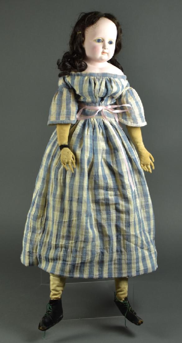 Sonneberg German Papier Mache Shoulderhead Doll: 28". Inset glass eyes, closed mouth. Dome head with brown human hair wig. Replaced cloth body with age. Cloth stitched arms and fingers. Head repainted but excellent. Antique clothing.