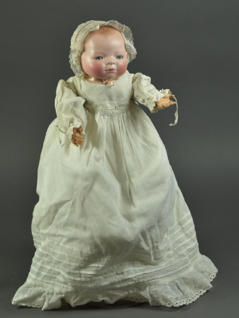 German Bisque Bye-Lo Baby by Grace Putnam: 14" H. 12" head circumference. Blue sleep eyes, celluloid hands, original Bye-Lo body. Dressed in antique christening gown and undies plus bonnet.
